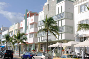 daytime view of buildings and palm trees along ocean drive in miami, florida