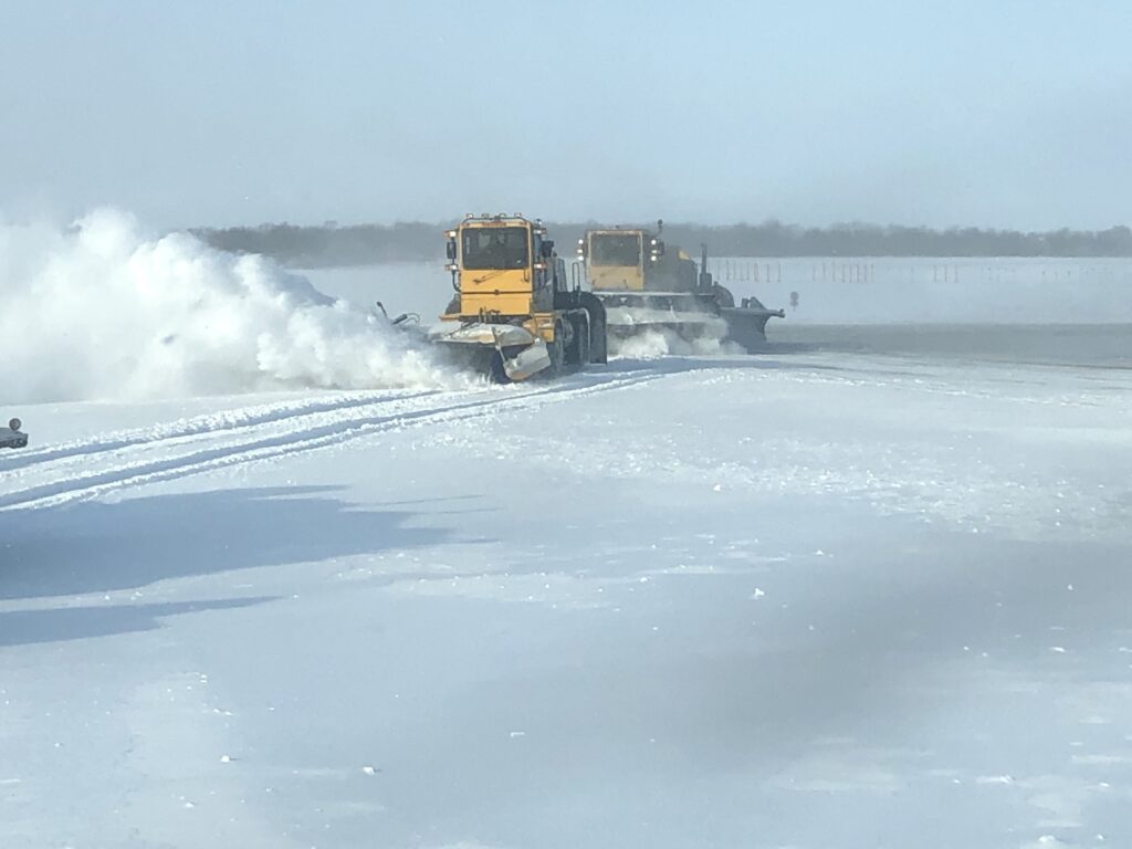 Snow plow clearing airfield